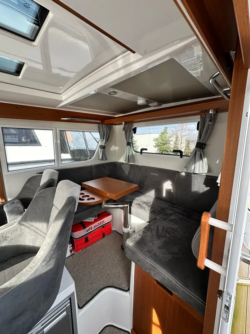 Slide: The Image of Interior of 2023 Sargo 28 boat with seating and table. - 19
