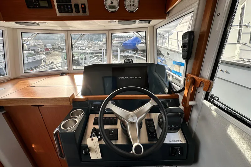Slide: The Image of Interior of 2023 Sargo 28 boat with modern steering console and panoramic windows. - 21