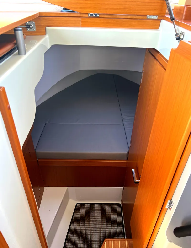 Slide: The Image of Interior cabin of 2023 Sargo 28 boat with wooden finish and cozy sleeping area. - 3