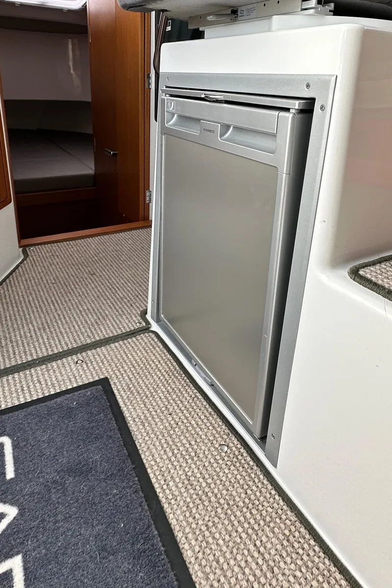 Slide: The Image of Compact kitchen area in 2023 Sargo 28 boat with modern fridge. - 30