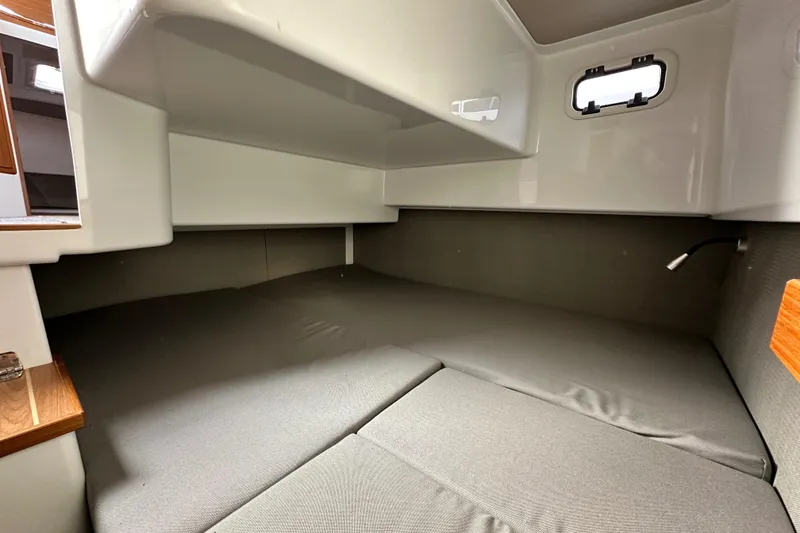 Slide: The Image of Interior cabin of 2023 Sargo 28 boat, featuring a cozy sleeping area. - 31