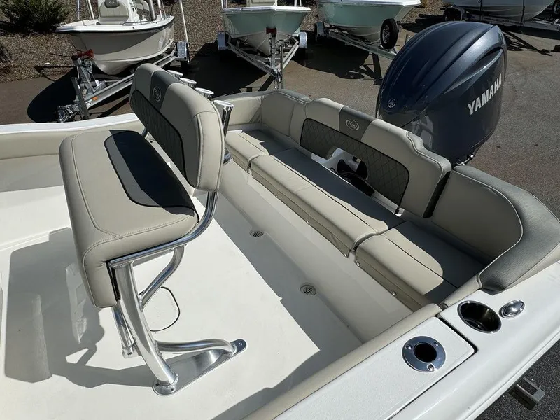 Slide: The Image of 2025 Key West 203 FS boat interior with cushioned seating and sleek design. - 14