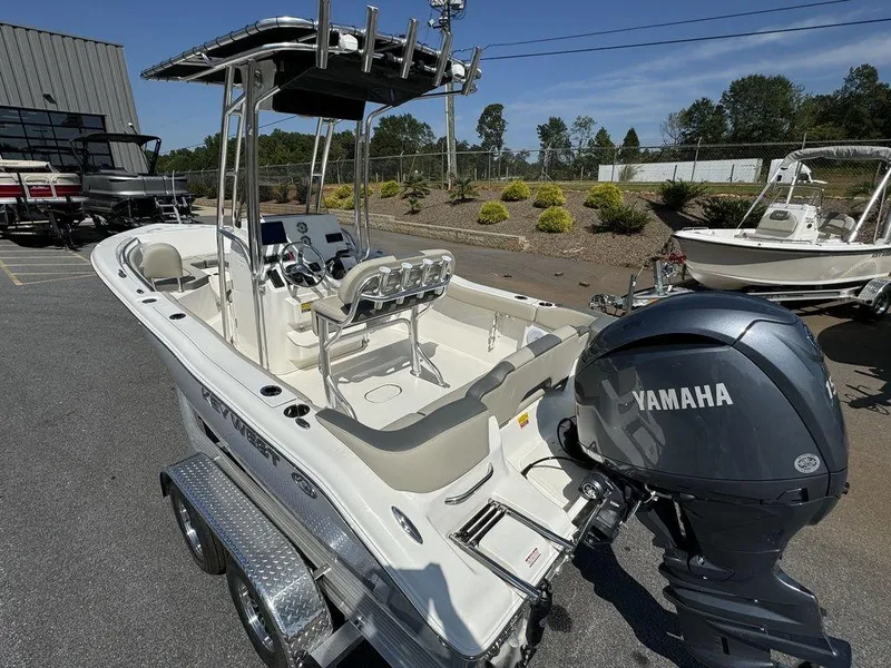 Slide: The Image of 2025 Key West 203 FS boat with outboard motor and seating area. - 15