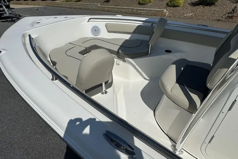Slide: The Image of 2025 Key West 203 FS boat interior with cushioned seating and sleek design. - 17