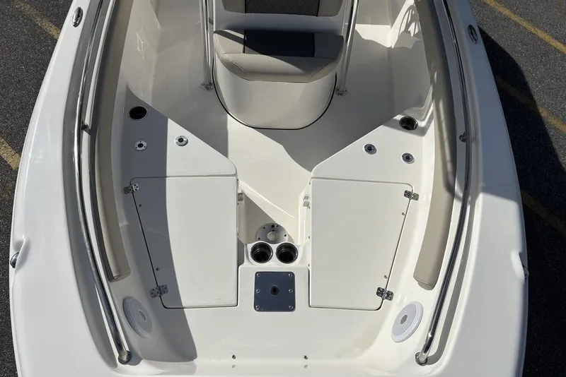 Slide: The Image of 2025 Key West 203 FS boat interior, featuring spacious seating and storage compartments. - 19