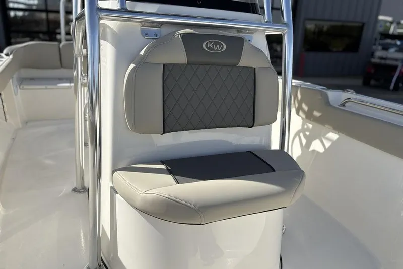 Slide: The Image of 2025 Key West 203 FS boat seat with gray and beige cushioned design. - 20