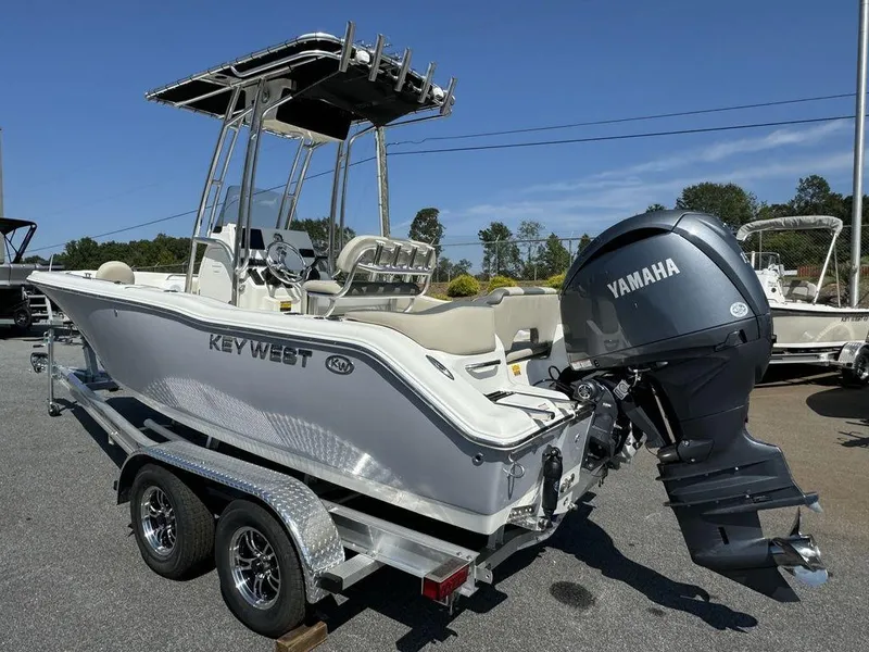 Slide: The Image of 2025 Key West 203 FS boat with Yamaha engine on trailer at dealership. - 4