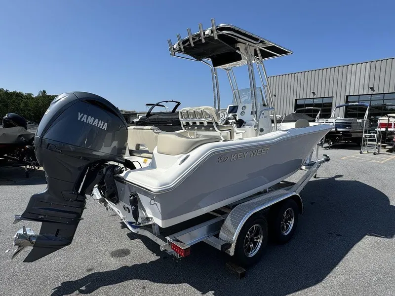Slide: The Image of 2025 Key West 203 FS boat with Yamaha engine on trailer in parking lot. - 5