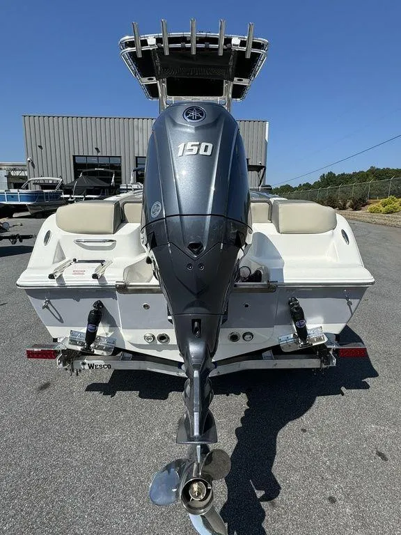 Slide: The Image of 2025 Key West 203 FS boat on trailer, side view, outdoors. - 6