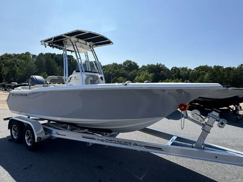 Slide: The Image of 2025 Key West 203 FS boat dashboard with steering wheel and controls. - 8