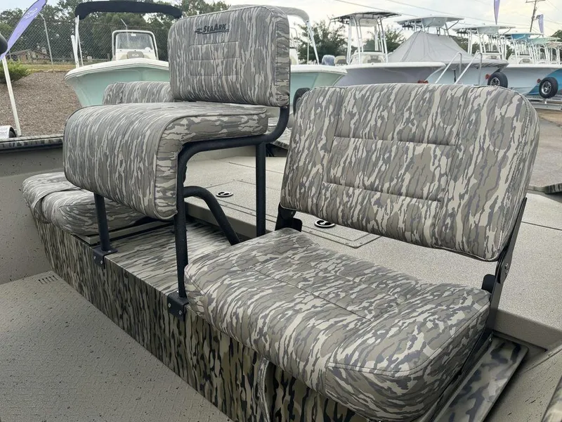 Slide: The Image of 2025 SeaArk Shadow 20 Elite CC boat seats with camouflage upholstery, showcasing modern design. - 15