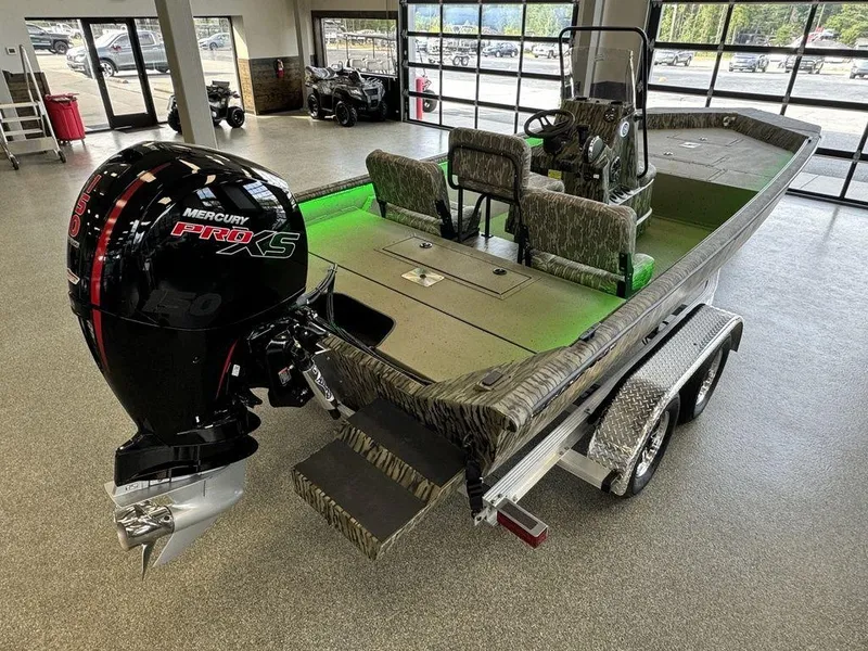 Slide: The Image of 2025 SeaArk Shadow 20 Elite CC boat with Mercury Pro XS engine in showroom. - 6