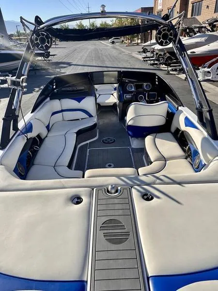 Slide: The Image of 2013 Malibu Wakesetter 21 VLX interior with plush seating and modern dashboard. - 10