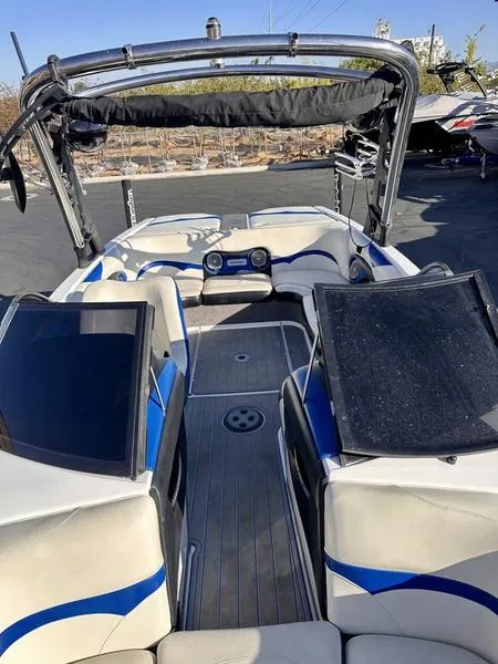 Slide: The Image of 2013 Malibu Wakesetter 21 VLX boat interior with blue accents and seating. - 3