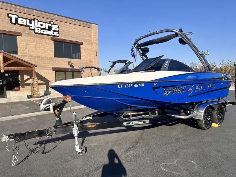 Slide: The Image of 2013 Malibu Wakesetter 21 VLX boat on trailer at Taylor's Boats dealership. - 4
