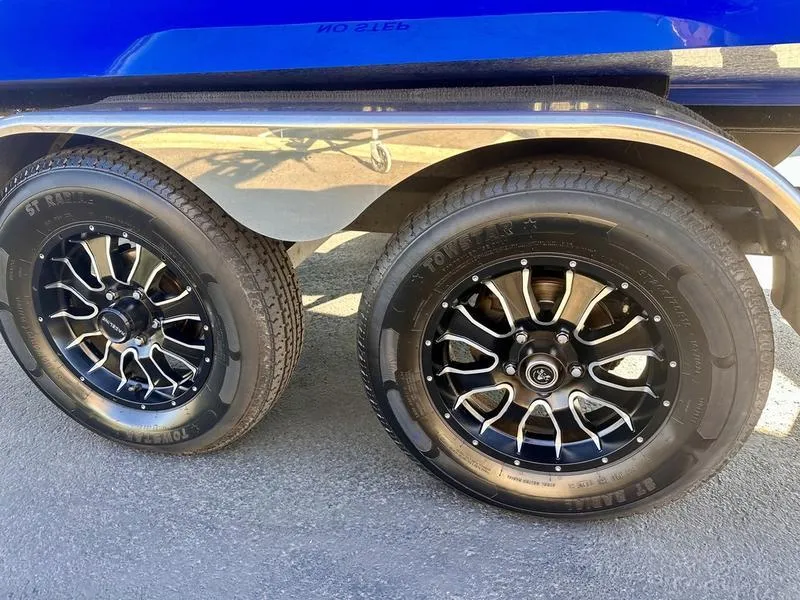 Slide: The Image of 2013 Malibu Wakesetter 21 VLX trailer with black alloy wheels. - 6