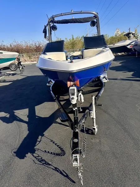 Slide: The Image of 2013 Malibu Wakesetter 21 VLX boat on trailer, parked outdoors. - 9