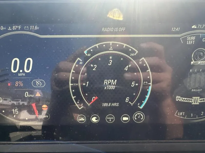 Slide: The Image of Dashboard of a 2020 Malibu 23 LSV boat showing RPM and speed. - 14