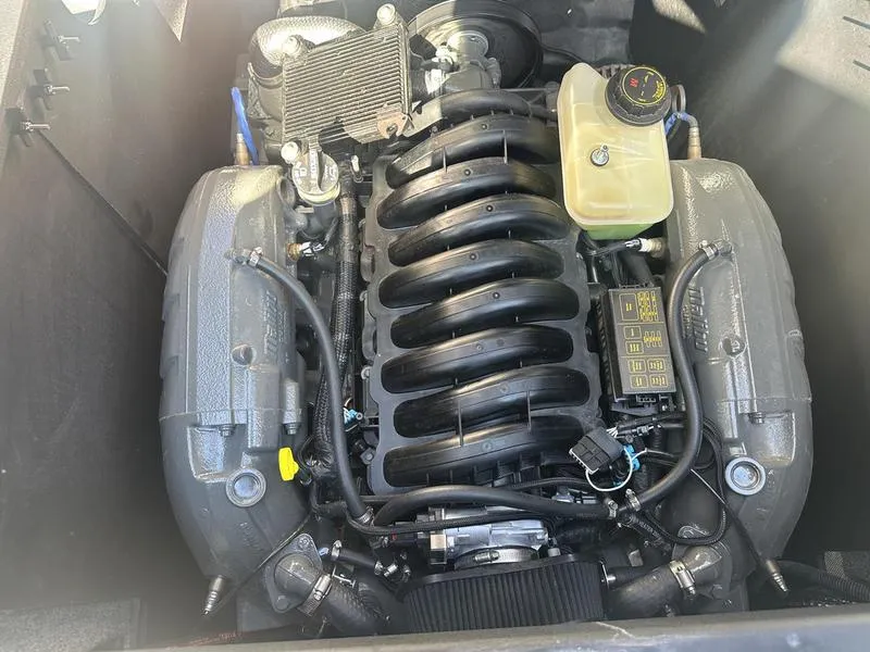 Slide: The Image of 2020 Malibu 23 LSV engine compartment, showcasing a powerful marine engine. - 16