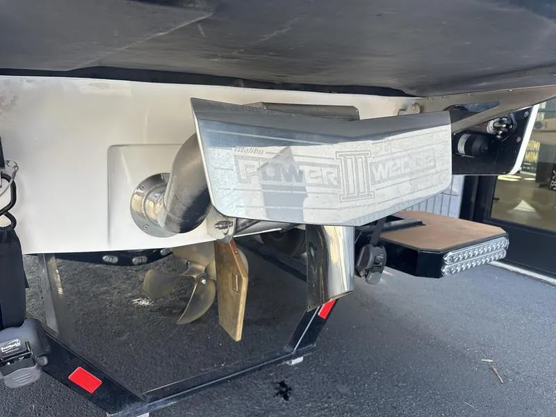 Slide: The Image of 2020 Malibu 23 LSV boat with Power Wedge III and propeller detail. - 2