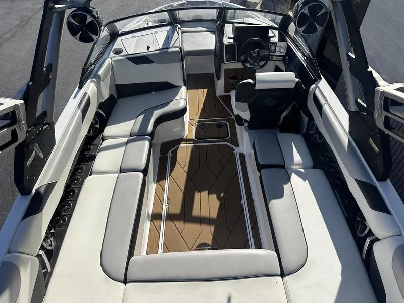 Slide: The Image of 2020 Malibu 23 LSV boat interior with spacious seating and modern design. - 5