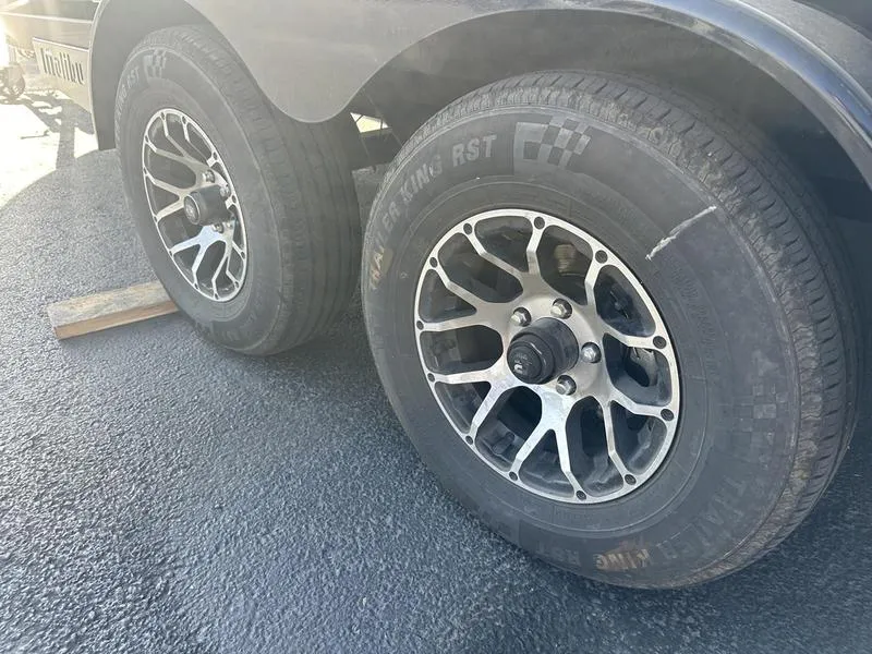 Slide: The Image of Close-up of 2020 Malibu 23 LSV trailer wheels on asphalt. - 6