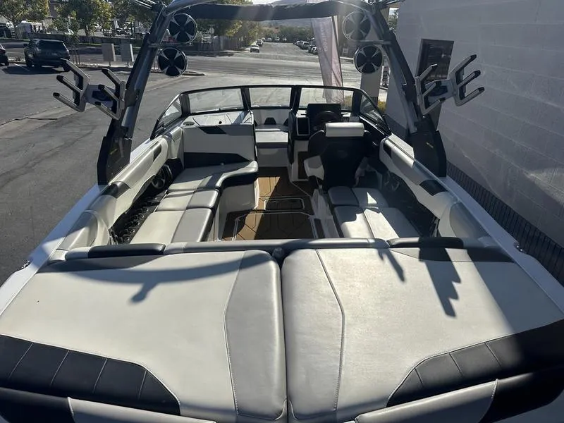 Slide: The Image of 2020 Malibu 23 LSV boat interior with spacious seating and modern design. - 7