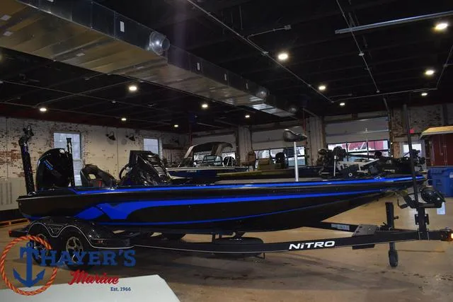 Slide: The Image of 2024 Nitro Z21 XL boat on trailer, parked outdoors. - 1