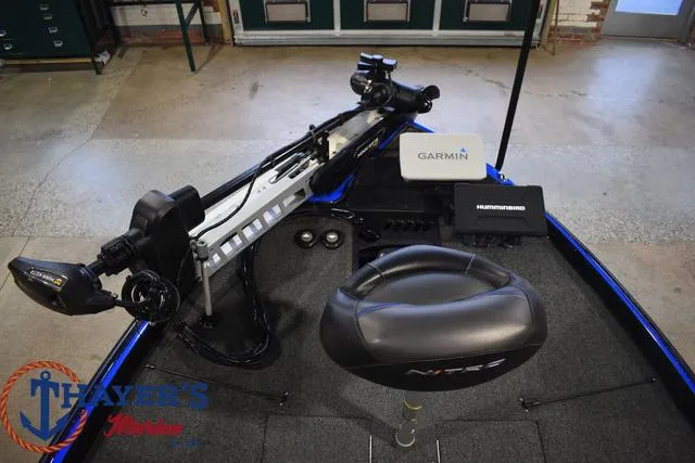 Slide: The Image of 2024 Nitro Z21 XL boat on trailer, parked outdoors. - 10