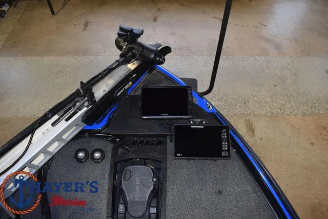 Slide: The Image of 2024 Nitro Z21 XL fishing boat with advanced equipment on a paved surface. - 11