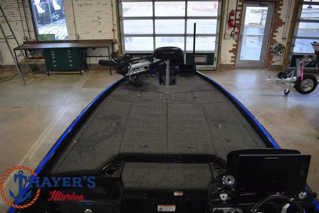 Slide: The Image of 2024 Nitro Z21 XL boat interior with Humminbird electronics and steering wheel. - 13