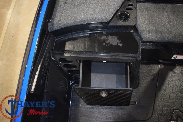Slide: The Image of 2024 Nitro Z21 XL boat compartment with Minn Kota Precision charger and hydraulic components. - 15