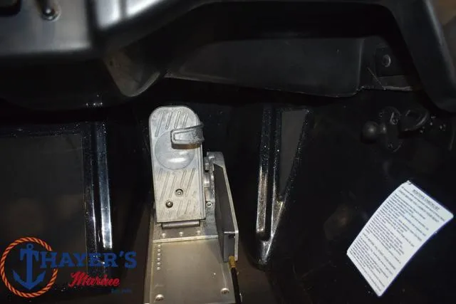 Slide: The Image of 2024 Nitro Z21 XL boat with open storage compartments, parked on a trailer. - 17