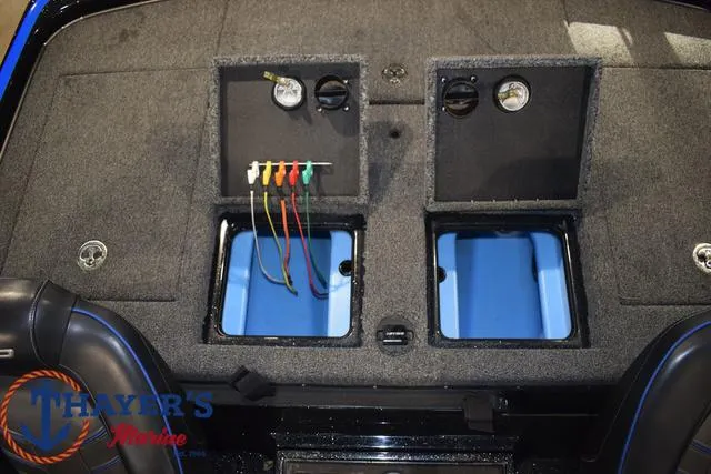 Slide: The Image of 2024 Nitro Z21 XL boat storage compartment with fishing gear and accessories. - 19