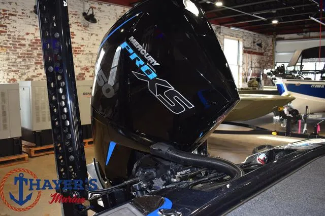 Slide: The Image of 2024 Nitro Z21 XL boat with advanced fishing equipment and Mastiff-branded vehicle in background. - 24