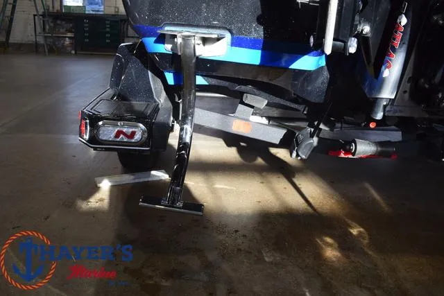 Slide: The Image of 2024 Nitro Z21 XL boat trailer detail in a showroom. - 28