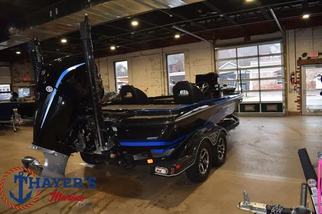 Slide: The Image of 2024 Nitro Z21 XL boat on trailer, parked outdoors. - 3