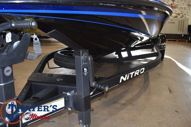 Slide: The Image of 2024 Nitro Z21 XL boat on trailer in showroom. - 30