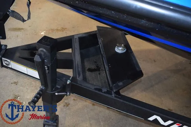 Slide: The Image of 2024 Nitro Z21 XL boat trailer with open storage compartment, Thayer's Marine logo visible. - 32