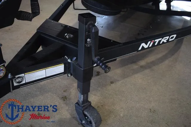 Slide: The Image of 2024 Nitro Z21 XL trailer with Thayer's Marine logo on concrete floor. - 33