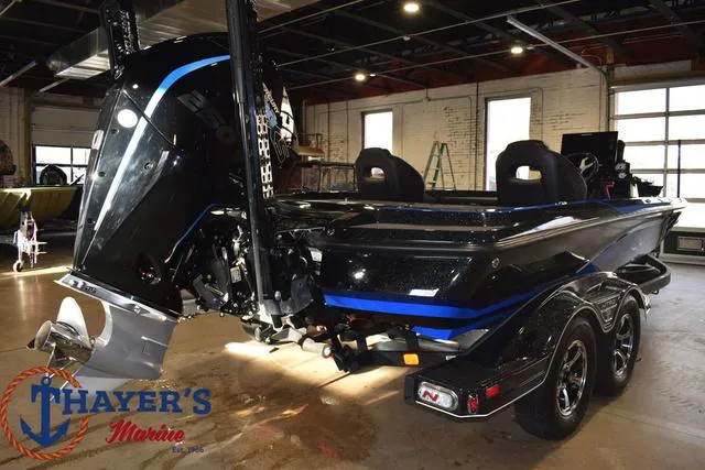 Slide: The Image of 2024 Nitro Z21 XL boat in showroom, featuring sleek design and powerful engine. - 36