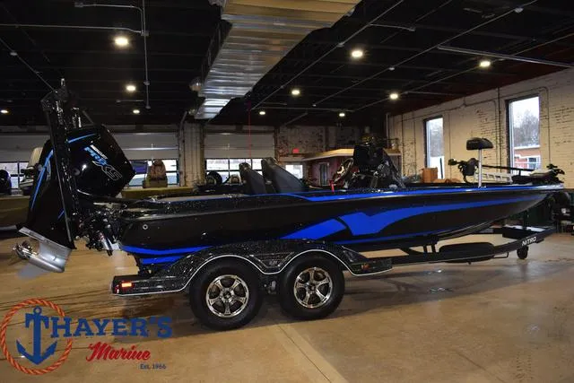 Slide: The Image of 2024 Nitro Z21 XL boat on trailer, parked outdoors. - 4