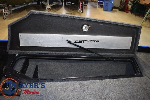 Slide: The Image of 2024 Nitro Z21 XL boat storage compartment with Thayer's Marine logo. - 40