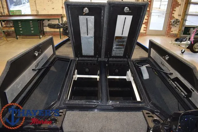 Slide: The Image of 2024 Nitro Z21 XL boat storage compartments open in showroom. - 43