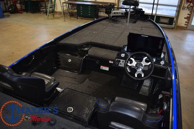 Slide: The Image of 2024 Nitro Z21 XL boat interior with steering wheel and seating. - 45