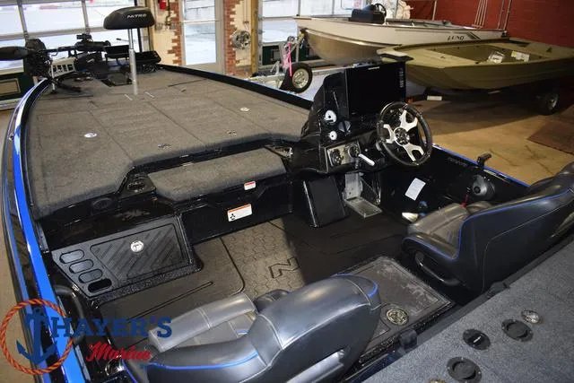 Slide: The Image of 2024 Nitro Z21 XL boat interior with steering wheel and seating. - 46