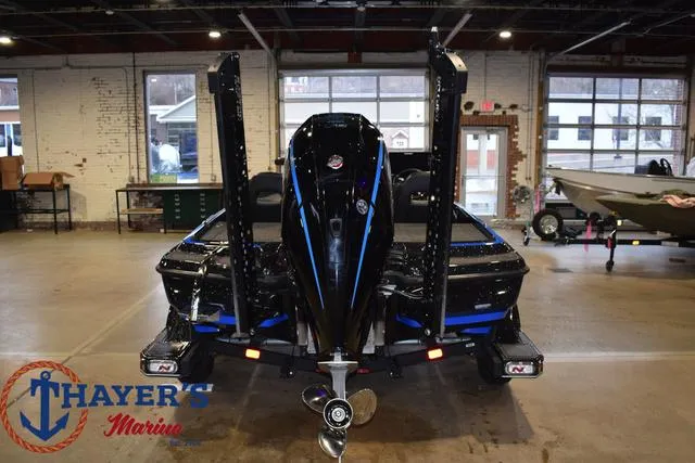 Slide: The Image of 2024 Nitro Z21 XL boat trailer with dual wheels on asphalt. - 5