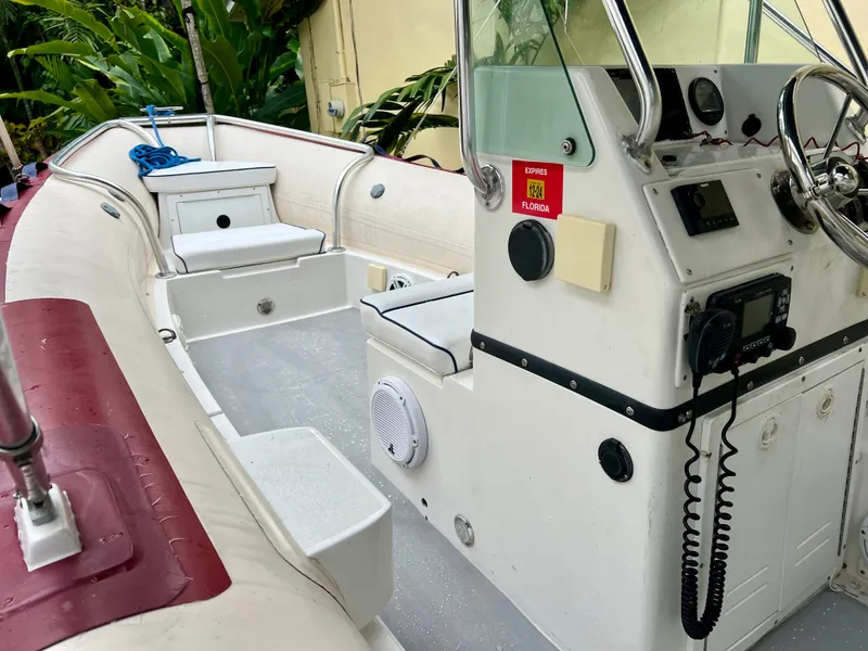 Slide: The Image of Novurania DL 550 2003 Hull boat interior, 2016 model, featuring steering console and seating. - 4
