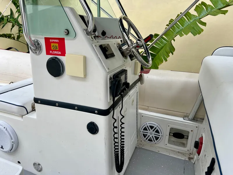 Slide: The Image of Novurania DL 550 2003 boat interior with steering wheel and control panel, 2016 model. - 6