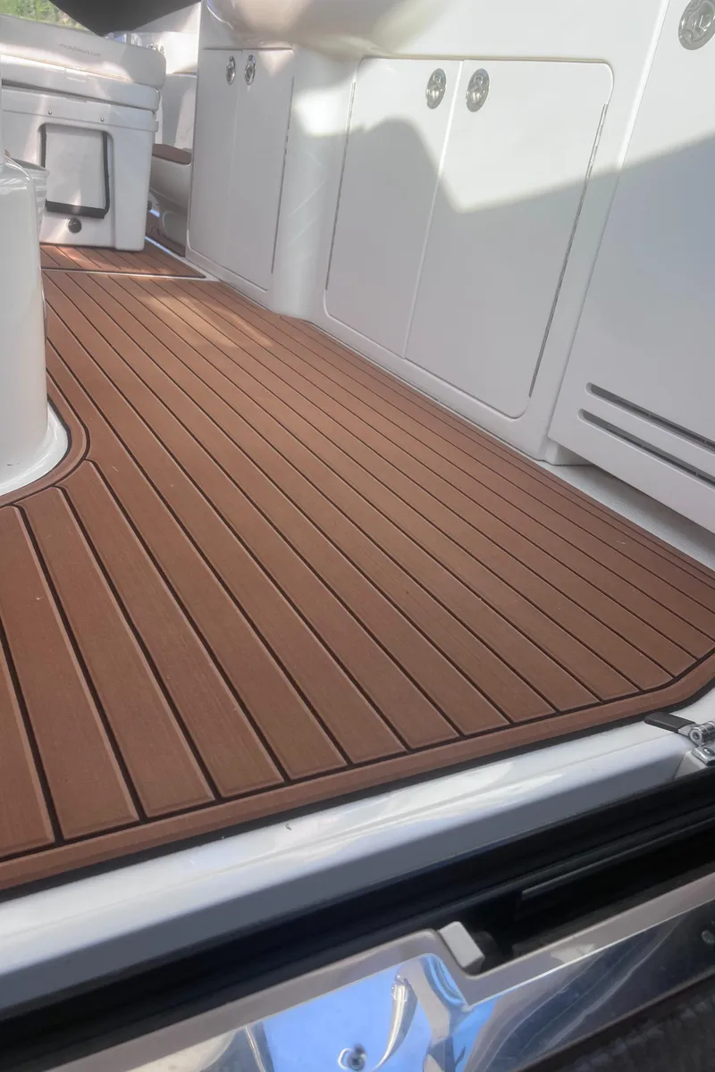 Slide: The Image of Luxurious seating area on 2000 Sea Ray 460 Sundancer yacht with elegant wood flooring. - 15